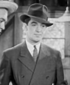 Anthony Warde in Escape by Night (1937)